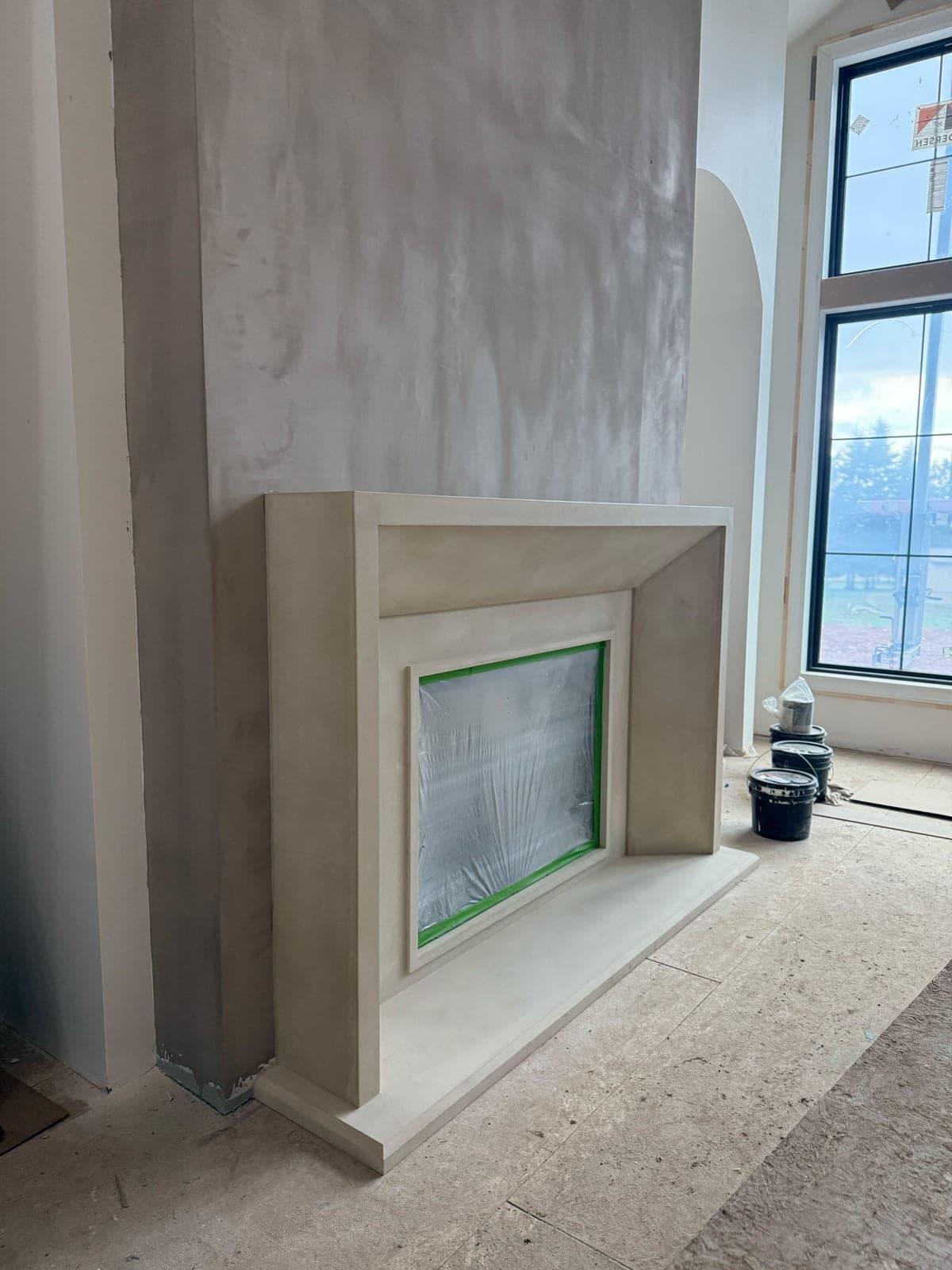 Cast stone custom vienna fireplace in Meadow Mist