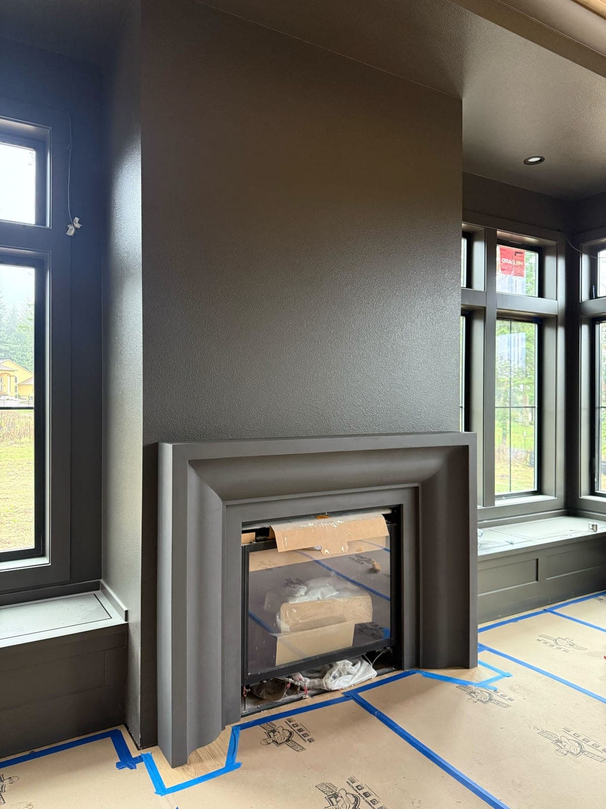Cast stone custom amalfi fireplace in Carbon Charcoal — living room