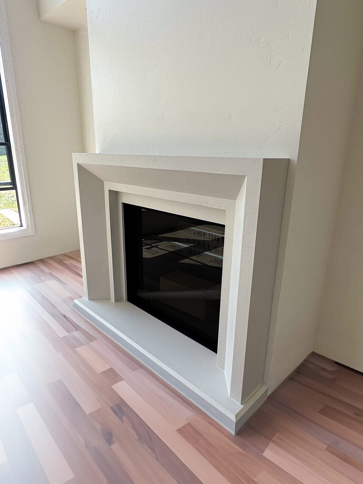 Cast stone newport fireplace in Subtle Gray — living room