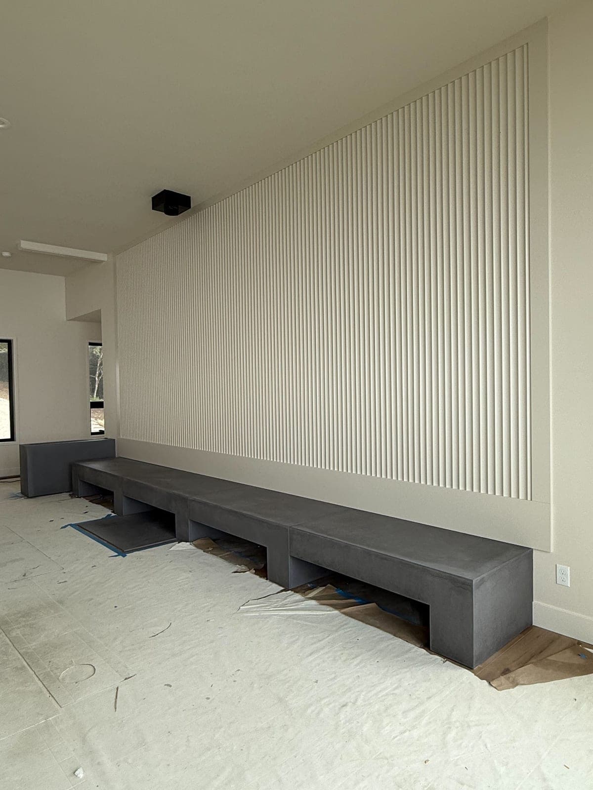 Cast stone custom hearth in Carbon Charcoal — living room