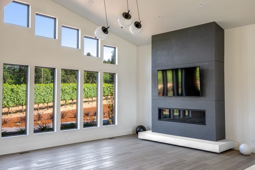 Cast stone custom fireplace panels — great room