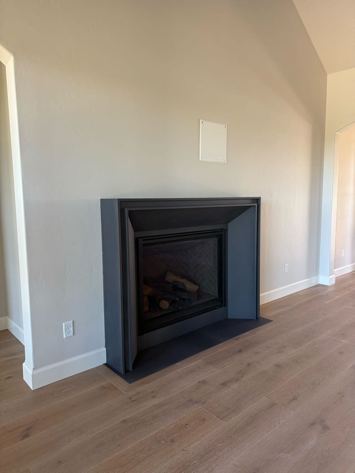 Cast stone custom lucca fireplace in Carbon Charcoal — living room