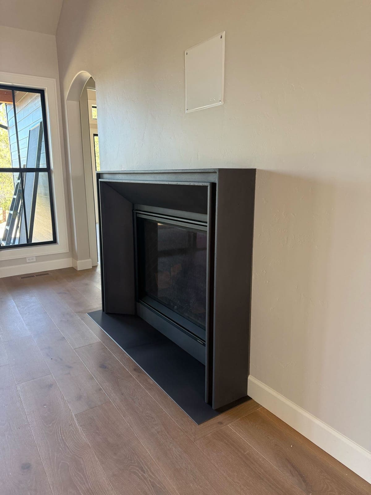 Cast stone custom lucca fireplace in Carbon Charcoal — living room