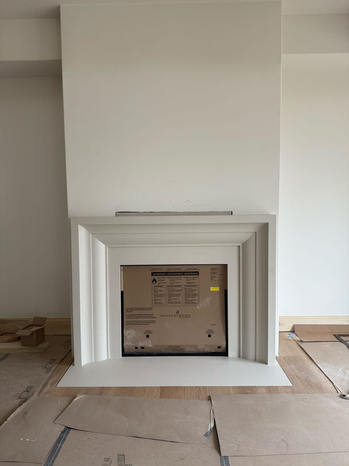 Cast stone custom amalfi fireplace in Subtle Gray — living room