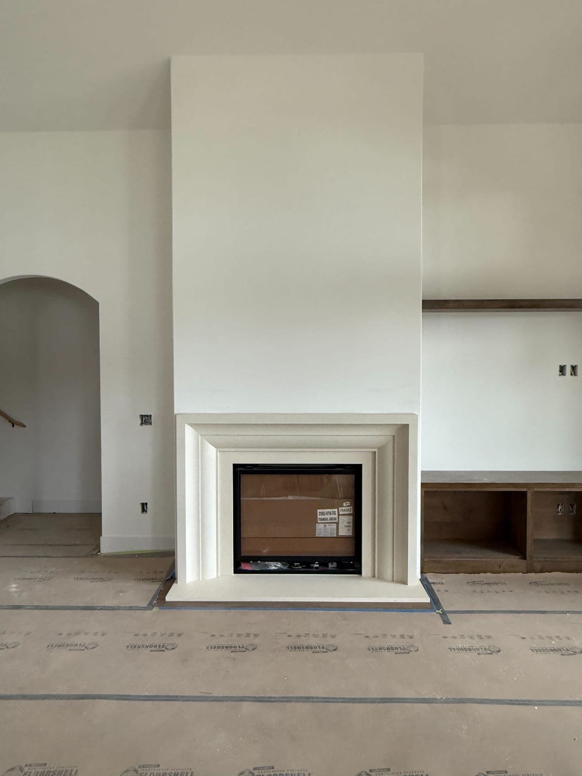Cast stone custom amalfi fireplace in Meadow Mist — living room