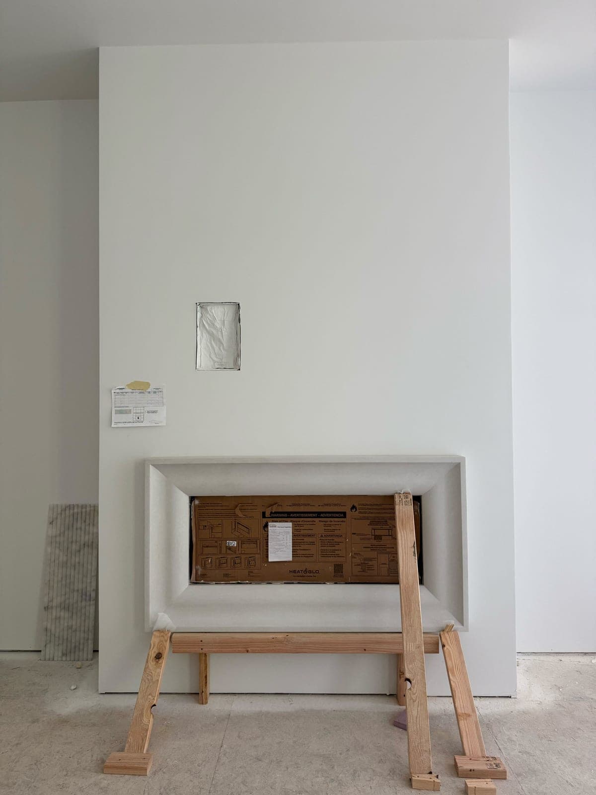 Cast stone custom fireplace in Italian White