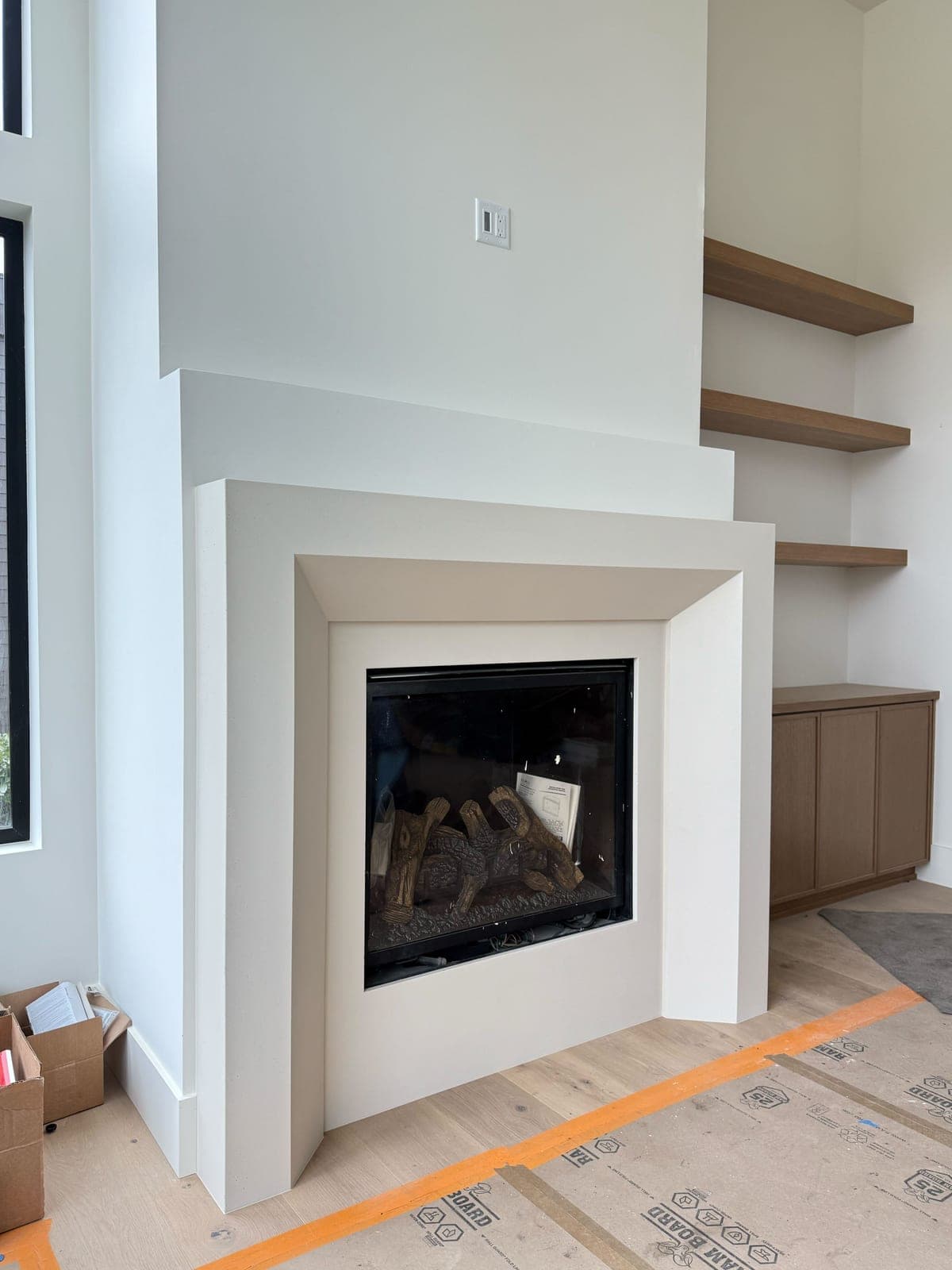 Cast stone custom monaco fireplace in Italian White — living room