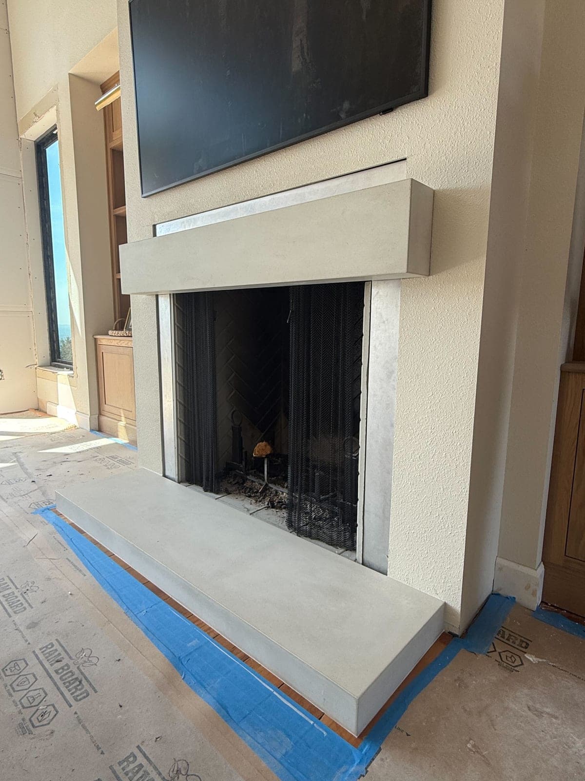 Cast stone custom mantel shelf & hearth in Subtle Gray — living room