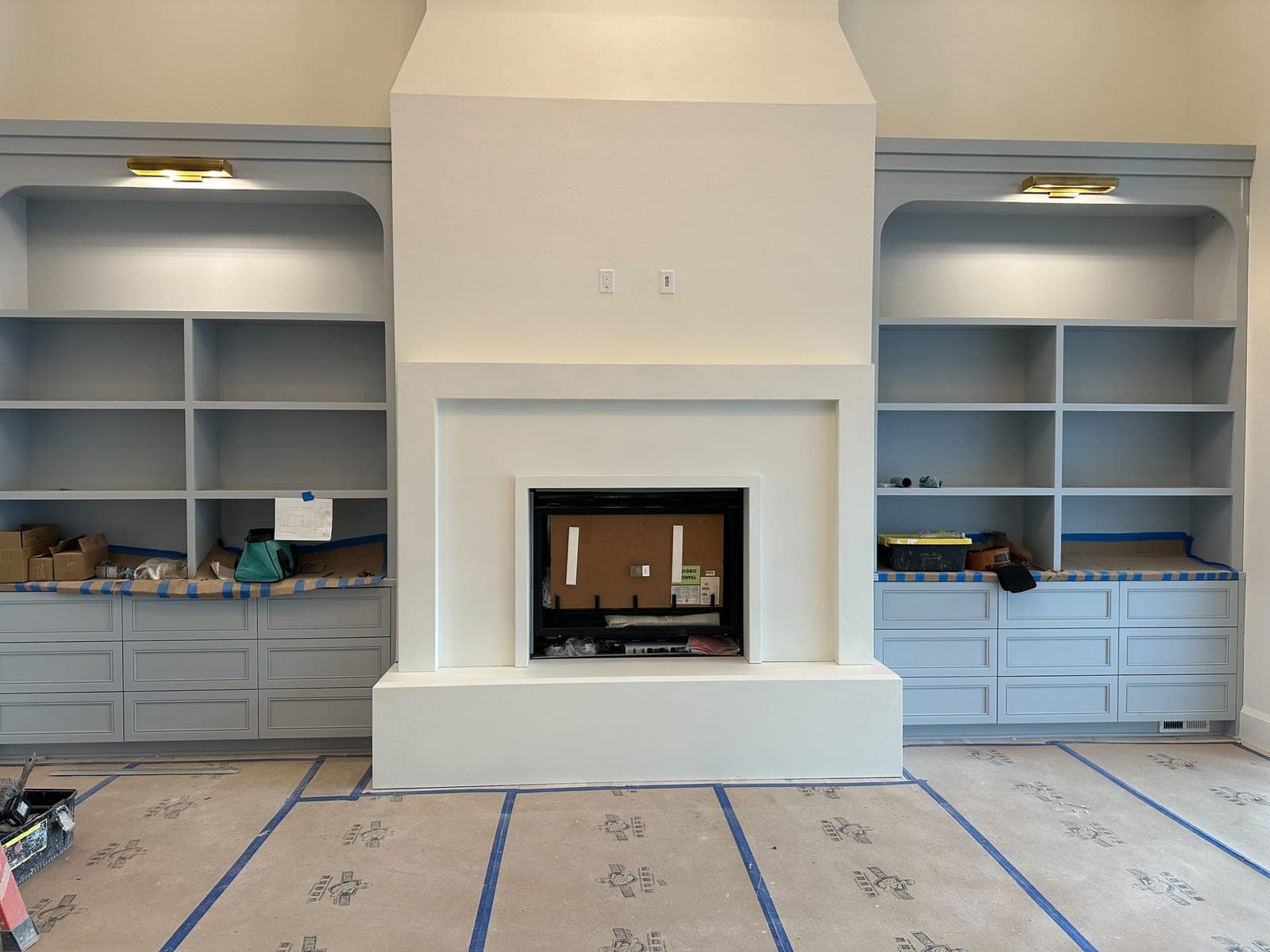 Cast stone custom como fireplace in Italian White — great room
