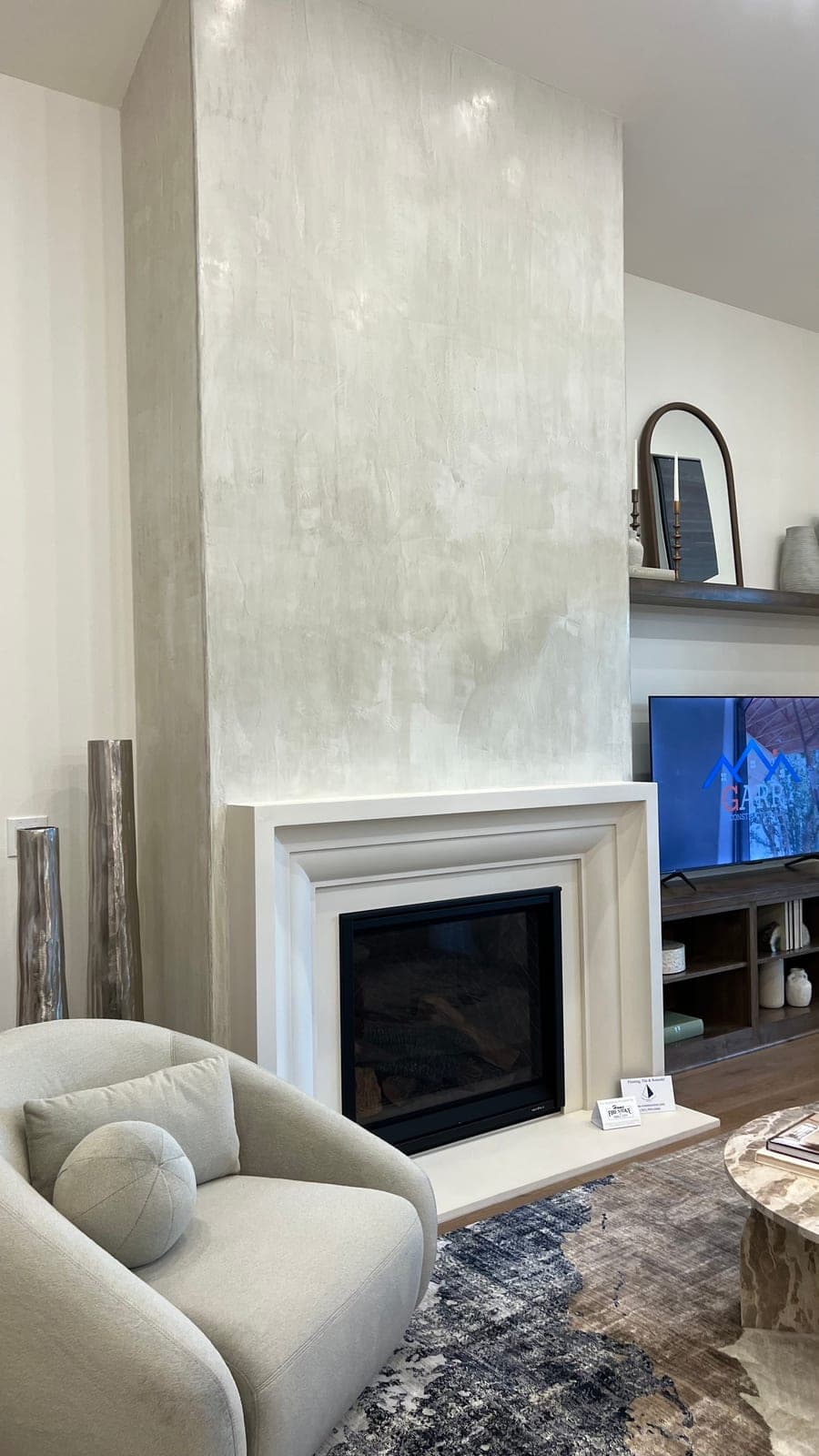 Cast stone amalfi fireplace in Meadow Mist — living room