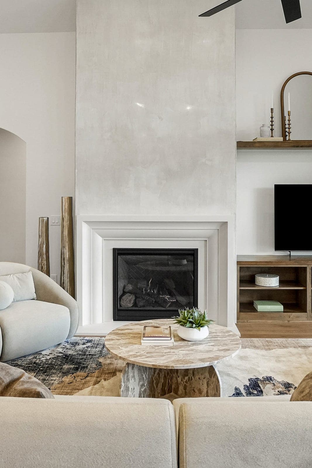 Cast stone amalfi fireplace in Meadow Mist — living room