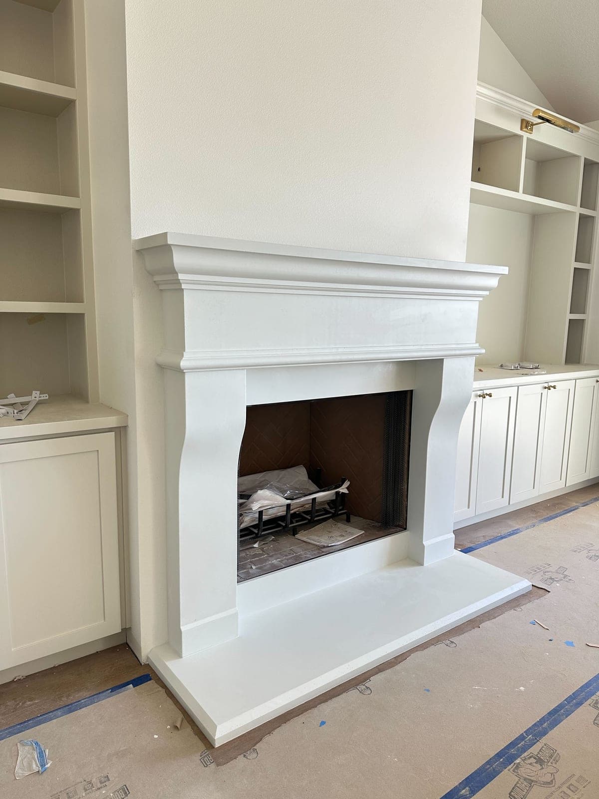 Cast stone custom new french fireplace in Italian White — living room