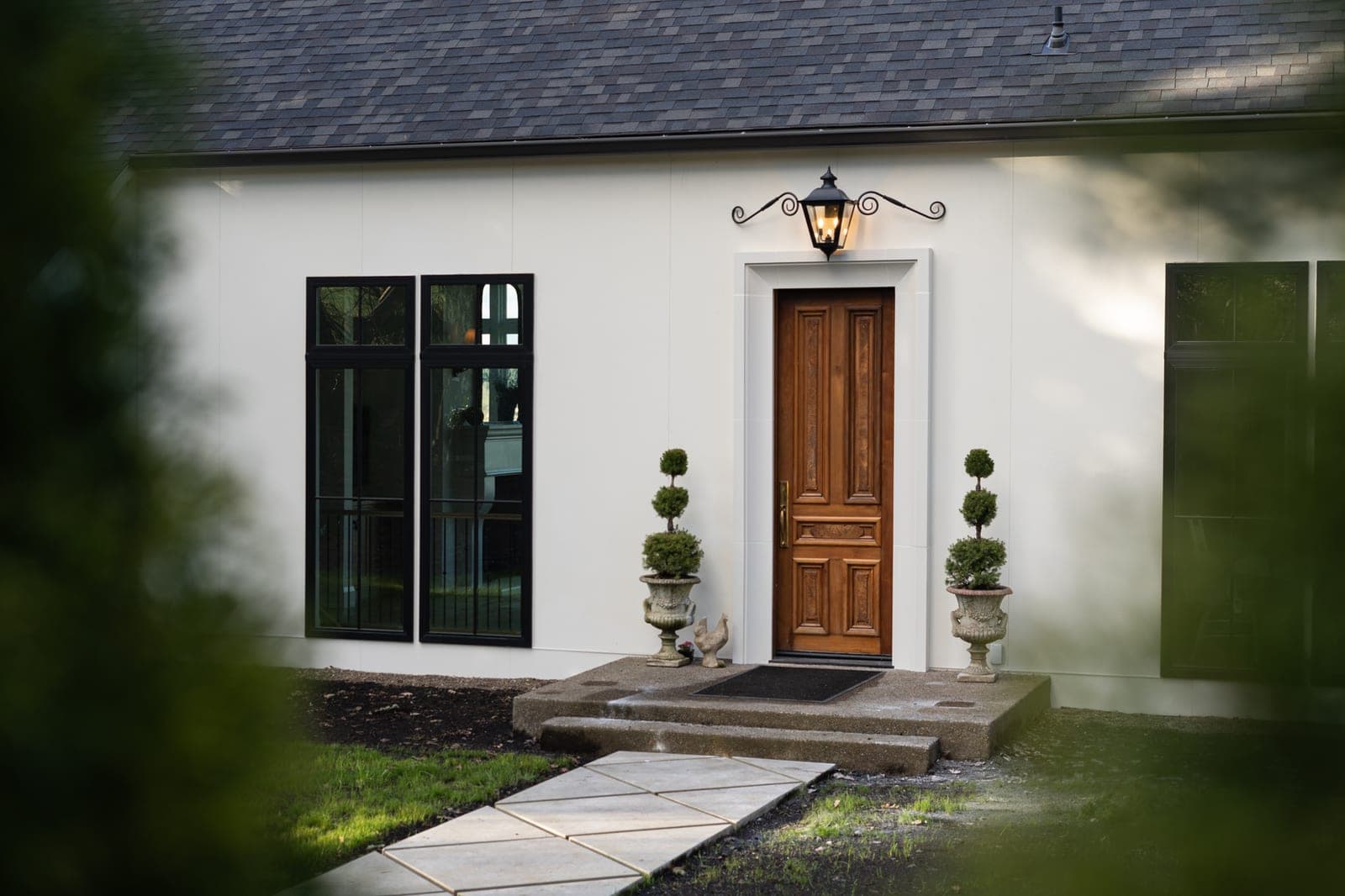 Exterior facade entrance with classical door surround, no fireplace visible.