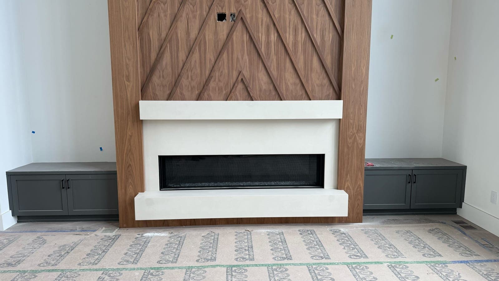 Minimalist cast-stone surround with clean linear profile and integrated linear fireplace insert.