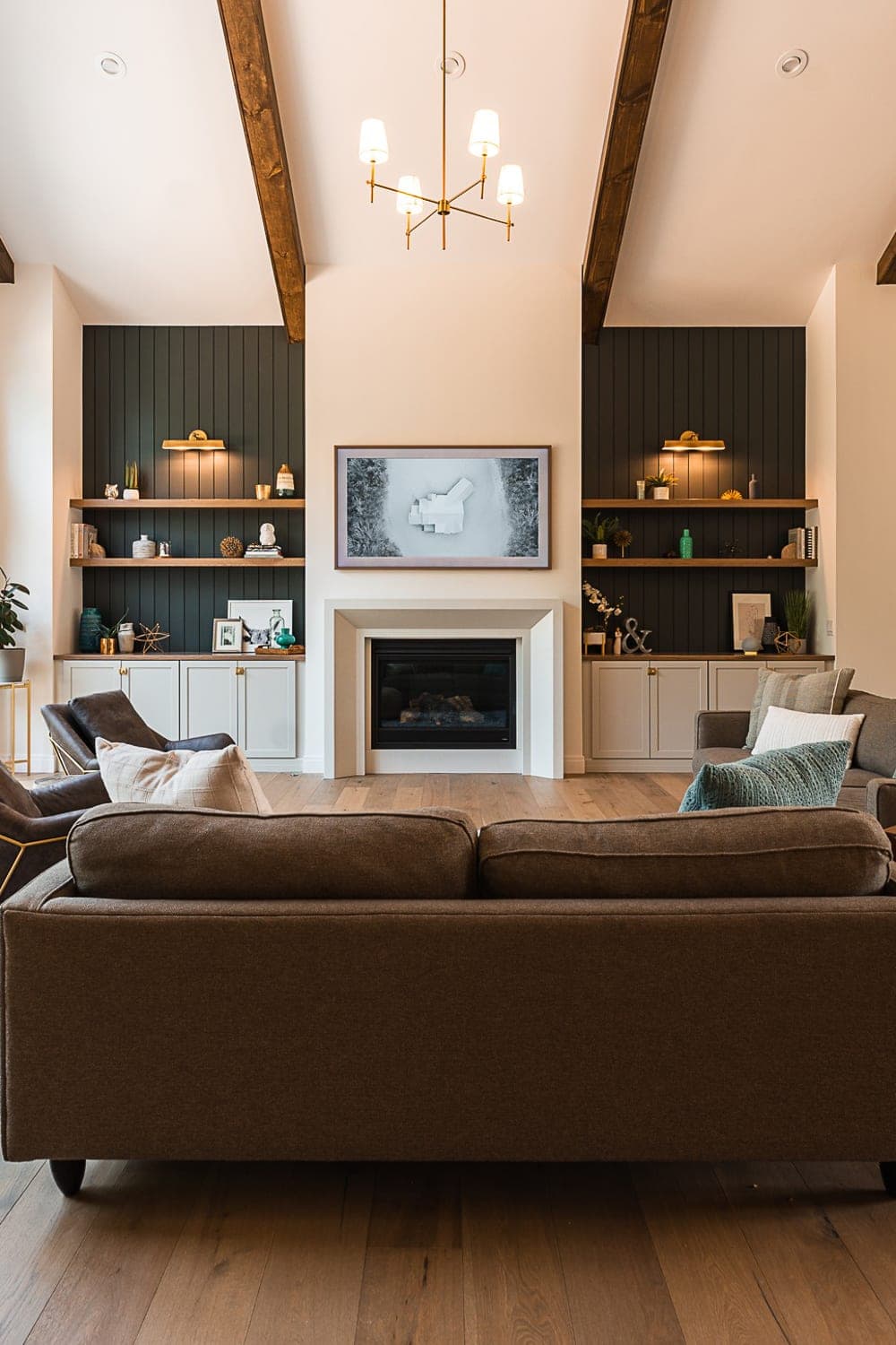 Contemporary great room with clean-lined cast stone surround anchoring open living space.