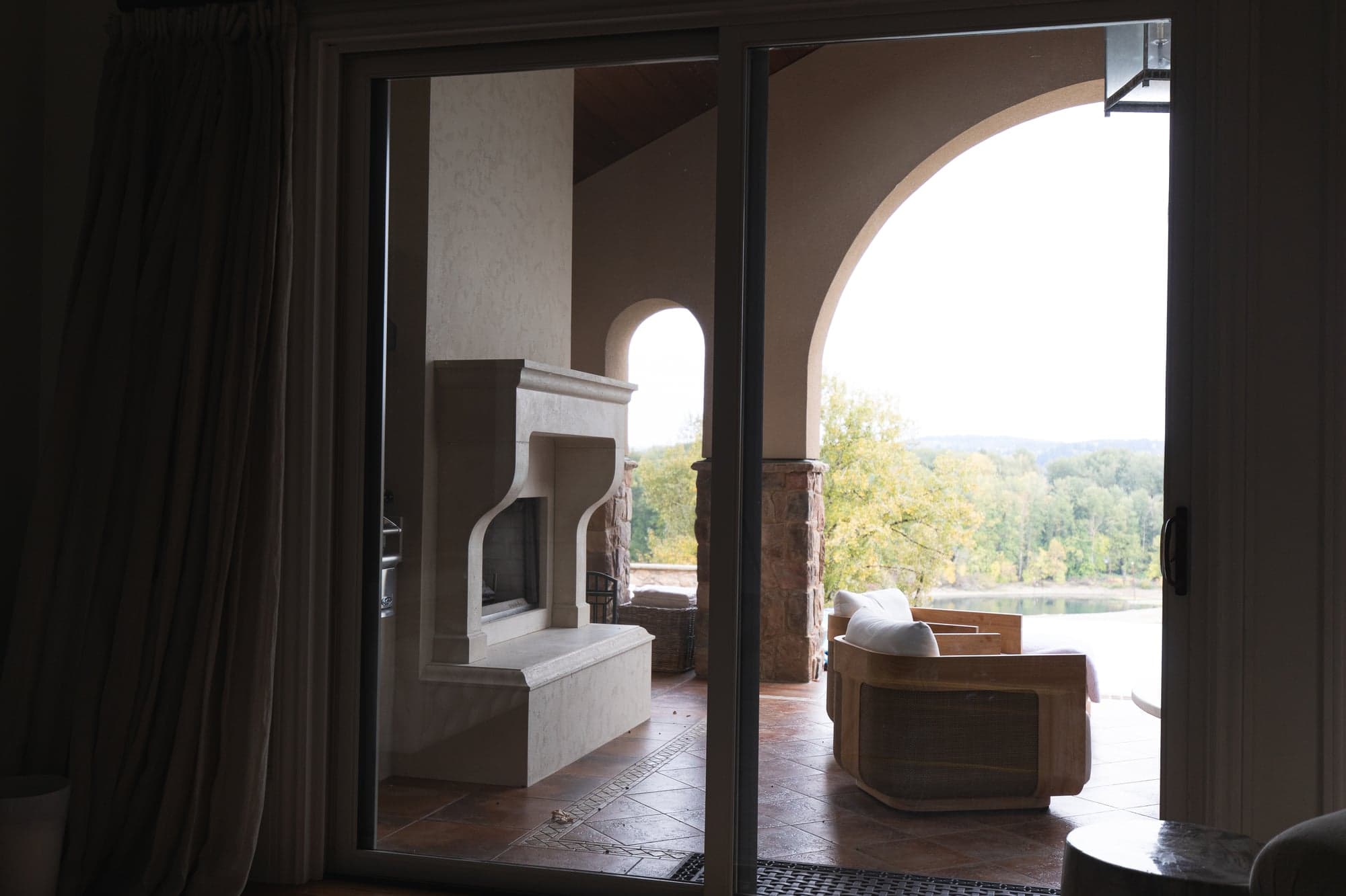 Cast stone fireplace surround installed in a residential interior.