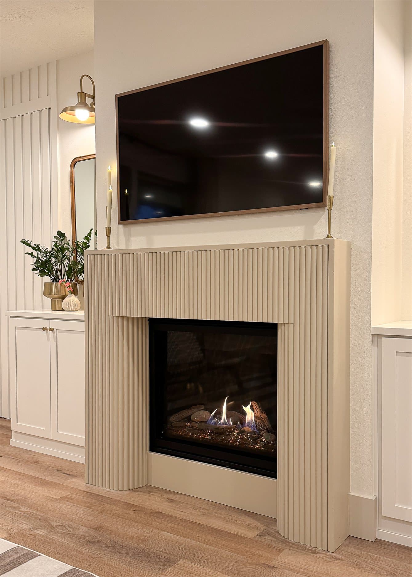 Cast stone fireplace surround installed in a Perch Homes residence.