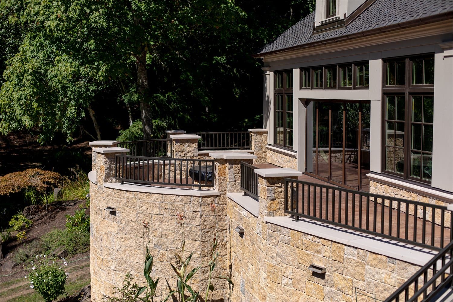 Cast stone exterior architectural element — pier cap or coping detail on a residential project.