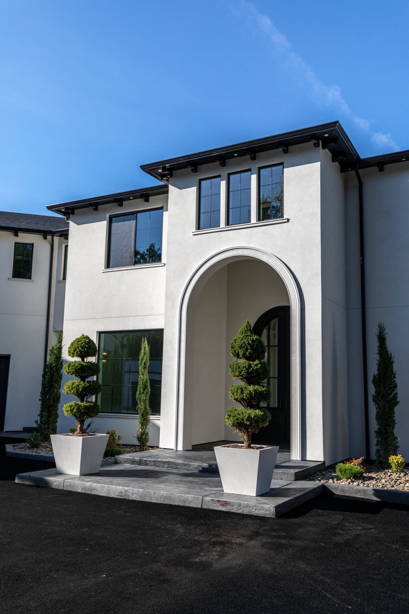 River Road Villa — cast stone program running from the entrance arch to the interior fireplaces