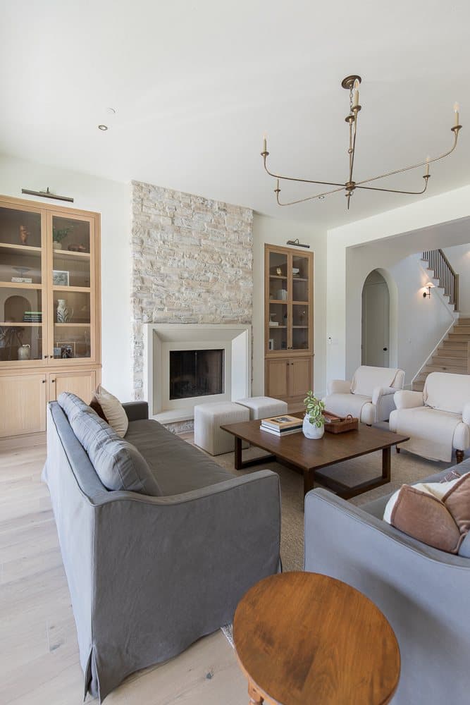 Small Residence — Milan cast stone fireplace with raised step-stone hearth.